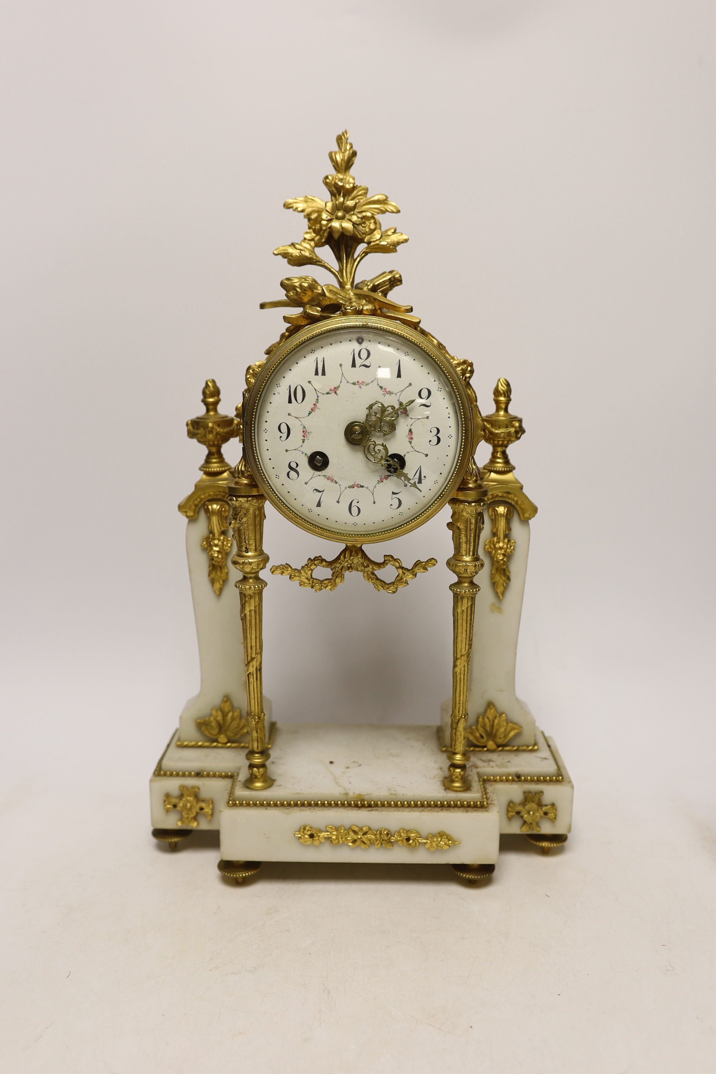 An early 20th century white marble and ormolu clock garniture with Arabic enamelled dial, 42cm high
